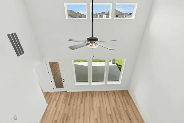 a view of a hallway with a chandelier