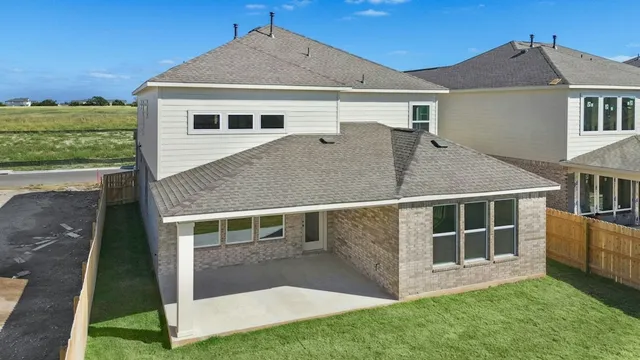 a view of house with yard