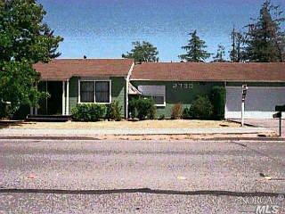 View from across the street. Two car garage door with a one car garage door on the rear of the garage for drive thru capability. County records show garage as huge 740 sq. feet