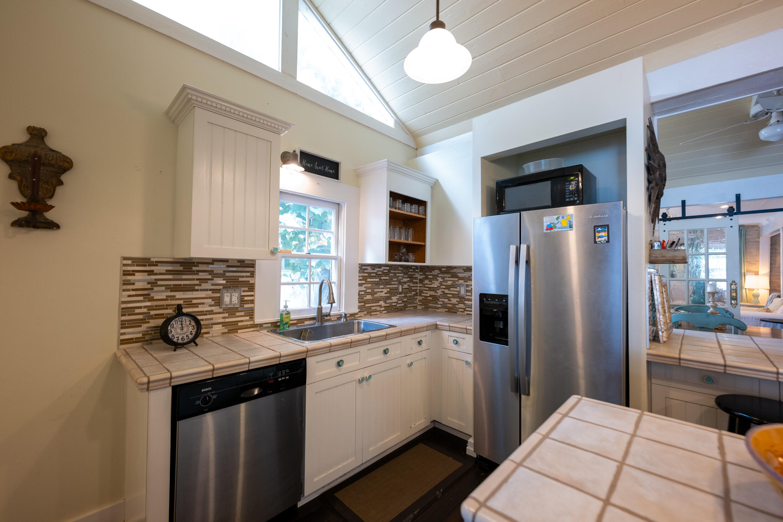 1109 Stump Lane Key West, FL 33040 - Photo 1 of 38 a kitchen with stainless steel appliances a refrigerator a sink and white cabinets
