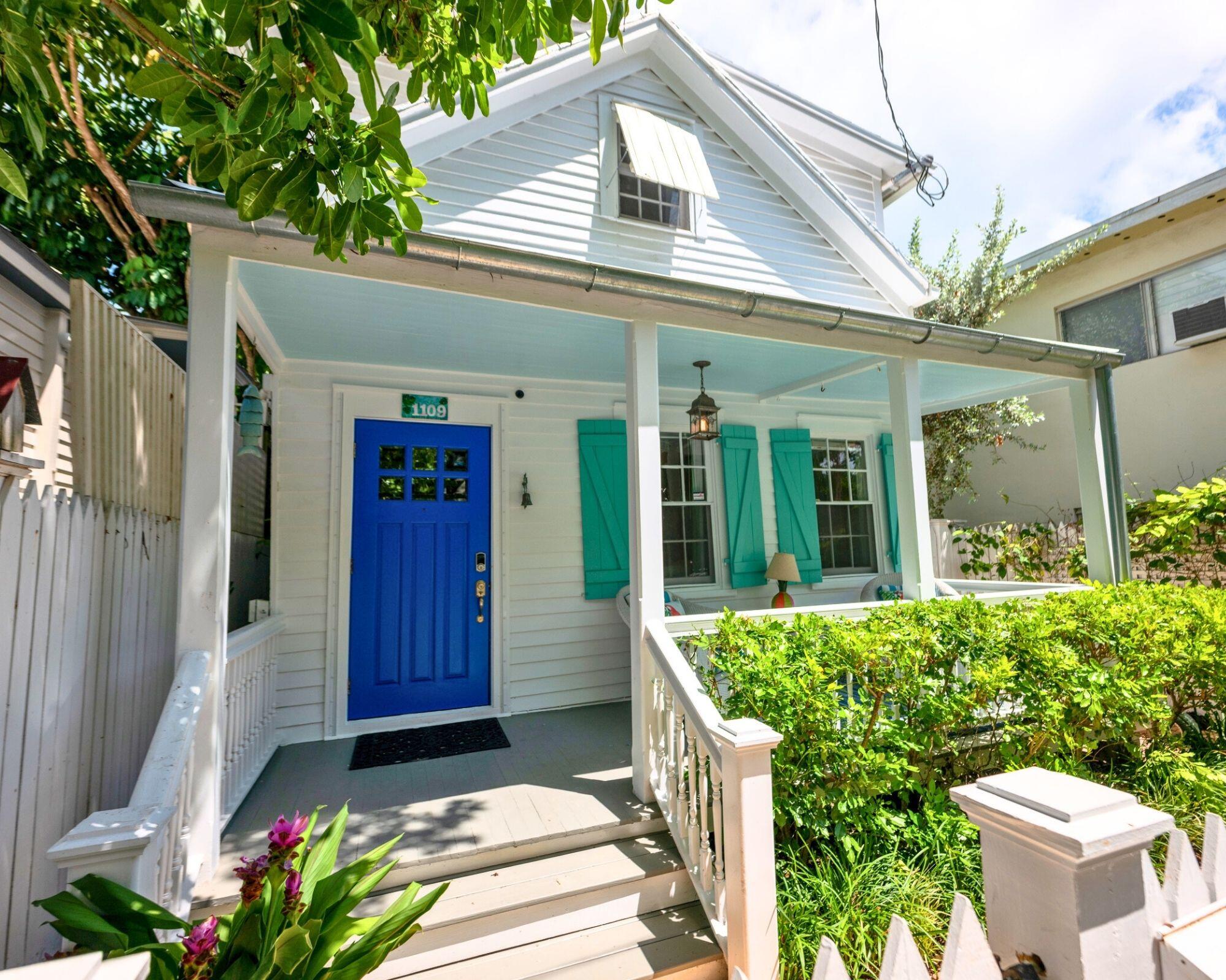 1109 Stump Lane Key West, FL 33040 - Photo 13 of 38 a view of a house with a potted plant and floor to ceiling window