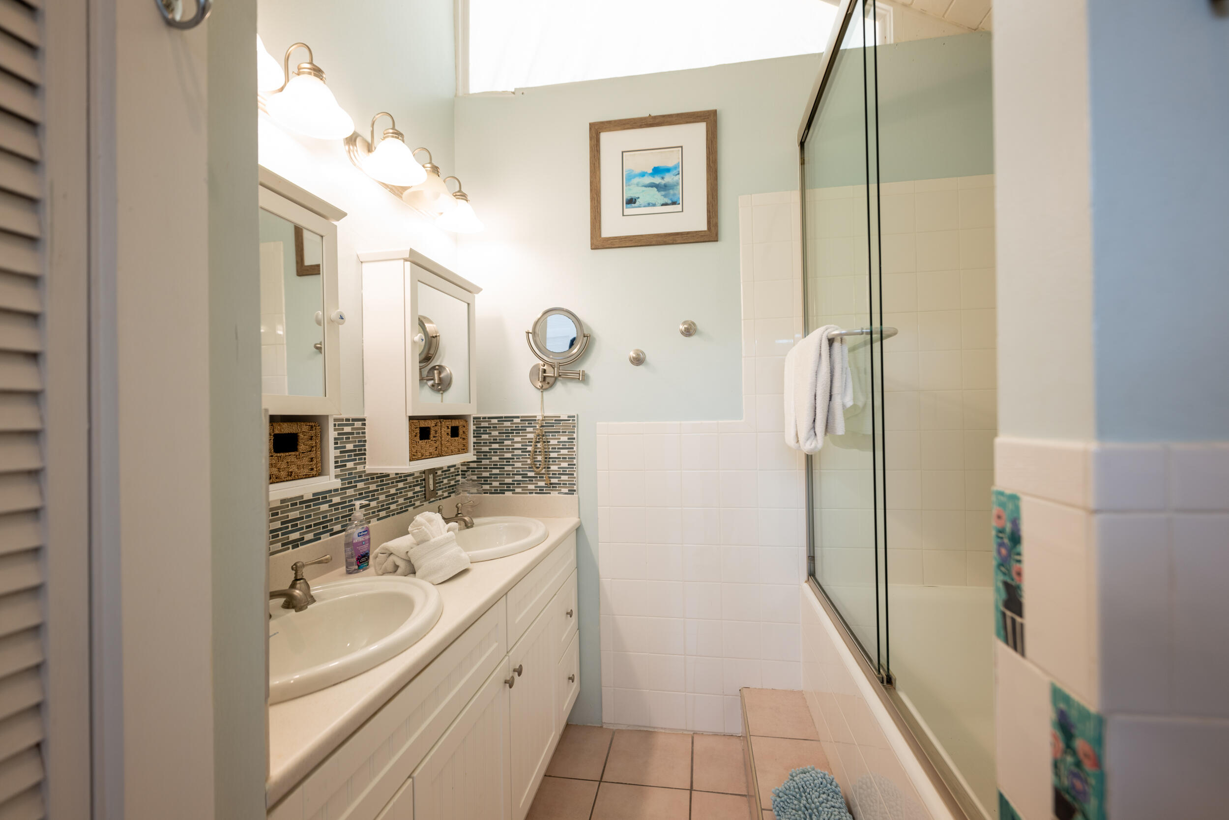 1109 Stump Lane Key West, FL 33040 - Photo 15 of 38 a bathroom with a sink a mirror and a shower