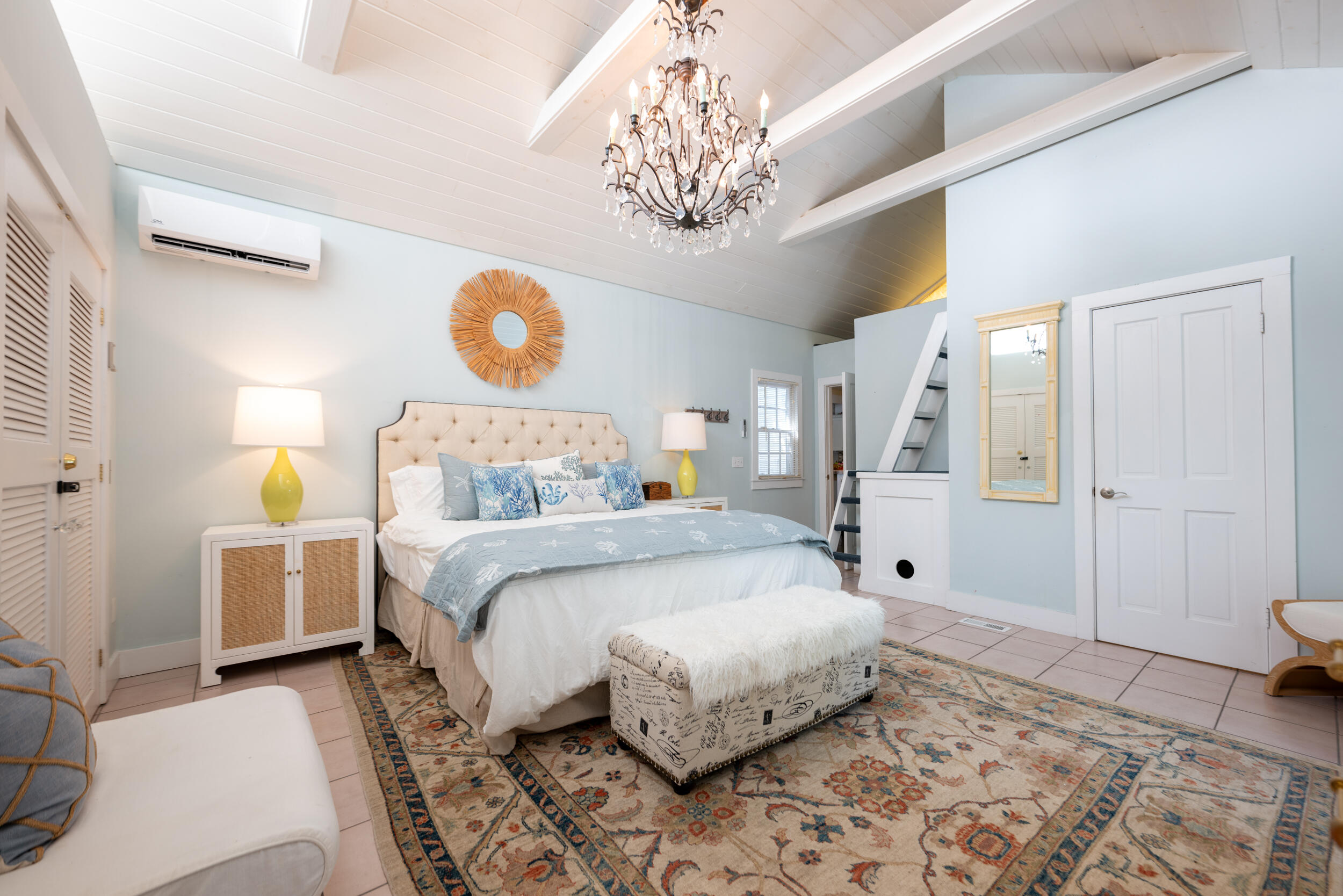 1109 Stump Lane Key West, FL 33040 - Photo 21 of 38 a bedroom with a bed and a chandelier