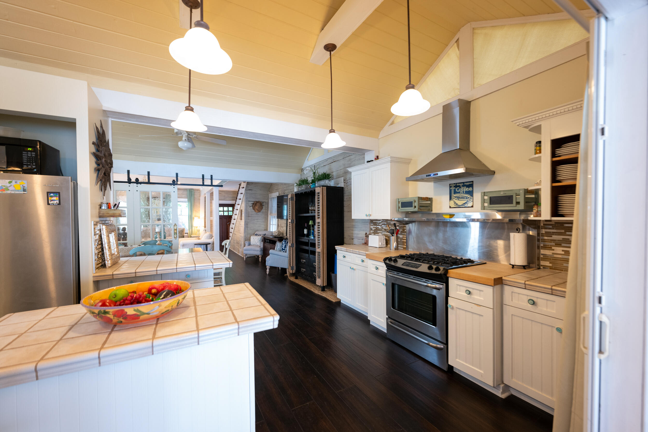 1109 Stump Lane Key West, FL 33040 - Photo 22 of 38 a kitchen with stainless steel appliances granite countertop a sink a stove and a refrigerator