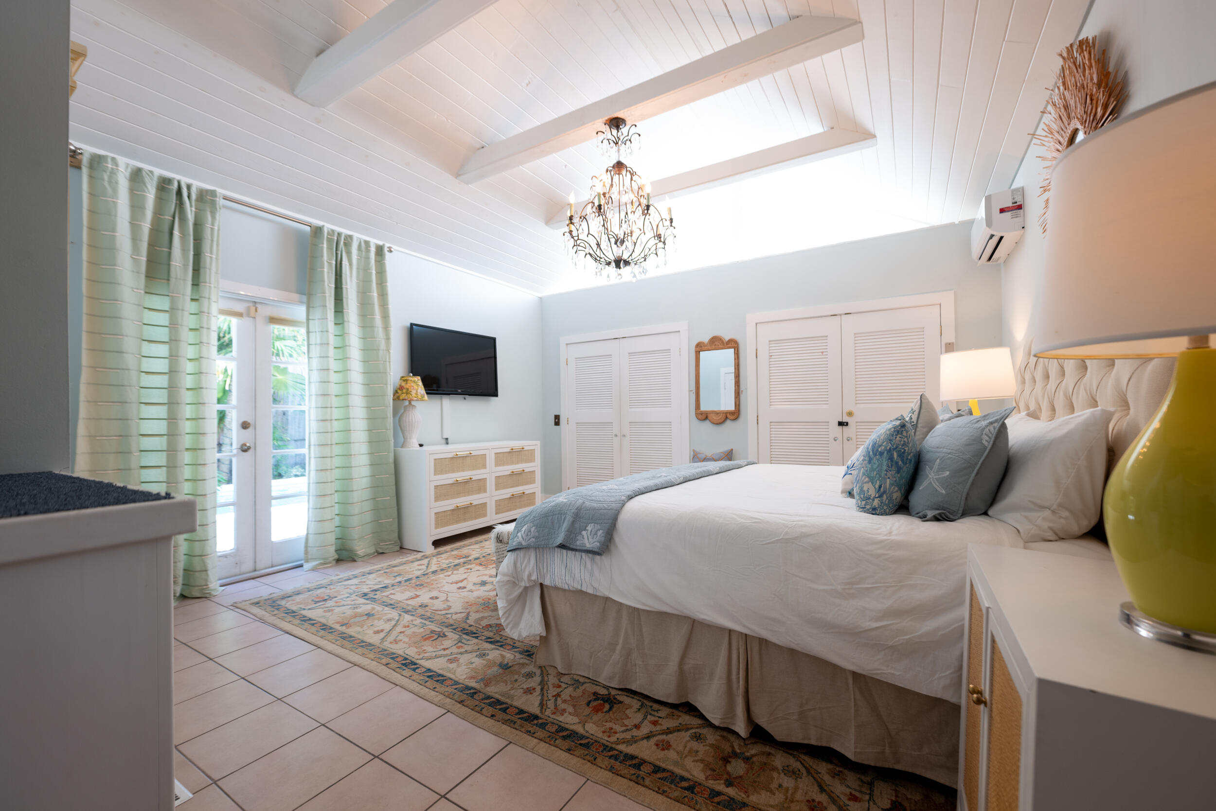 1109 Stump Lane Key West, FL 33040 - Photo 25 of 38 a bedroom with a bed and a flat screen tv