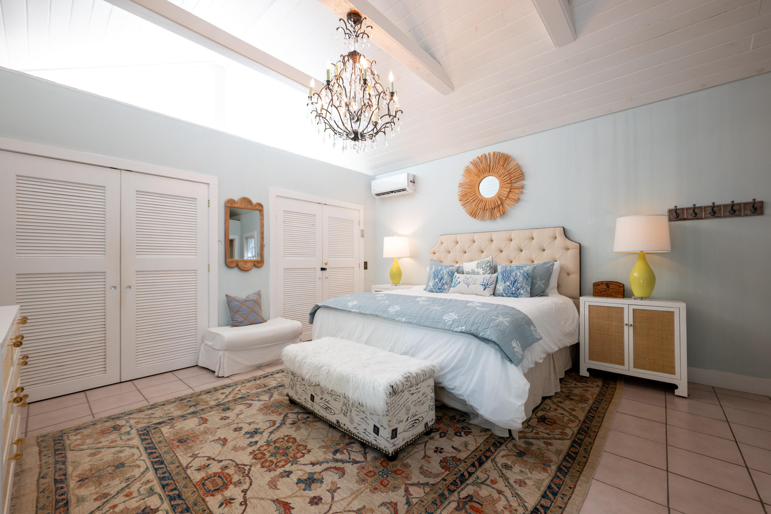 1109 Stump Lane Key West, FL 33040 - Photo 26 of 38 a bedroom with a bed and a chandelier