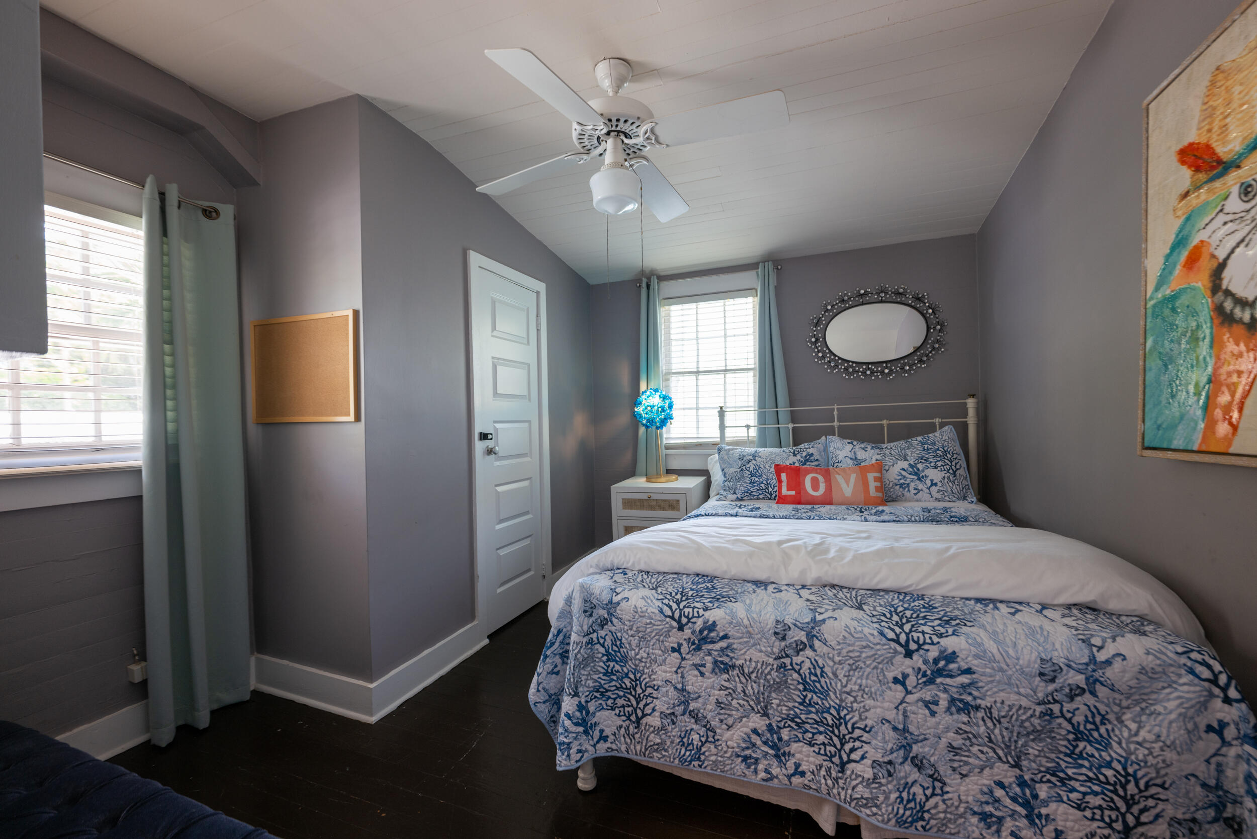 1109 Stump Lane Key West, FL 33040 - Photo 29 of 38 a bedroom with a bed and a chandelier