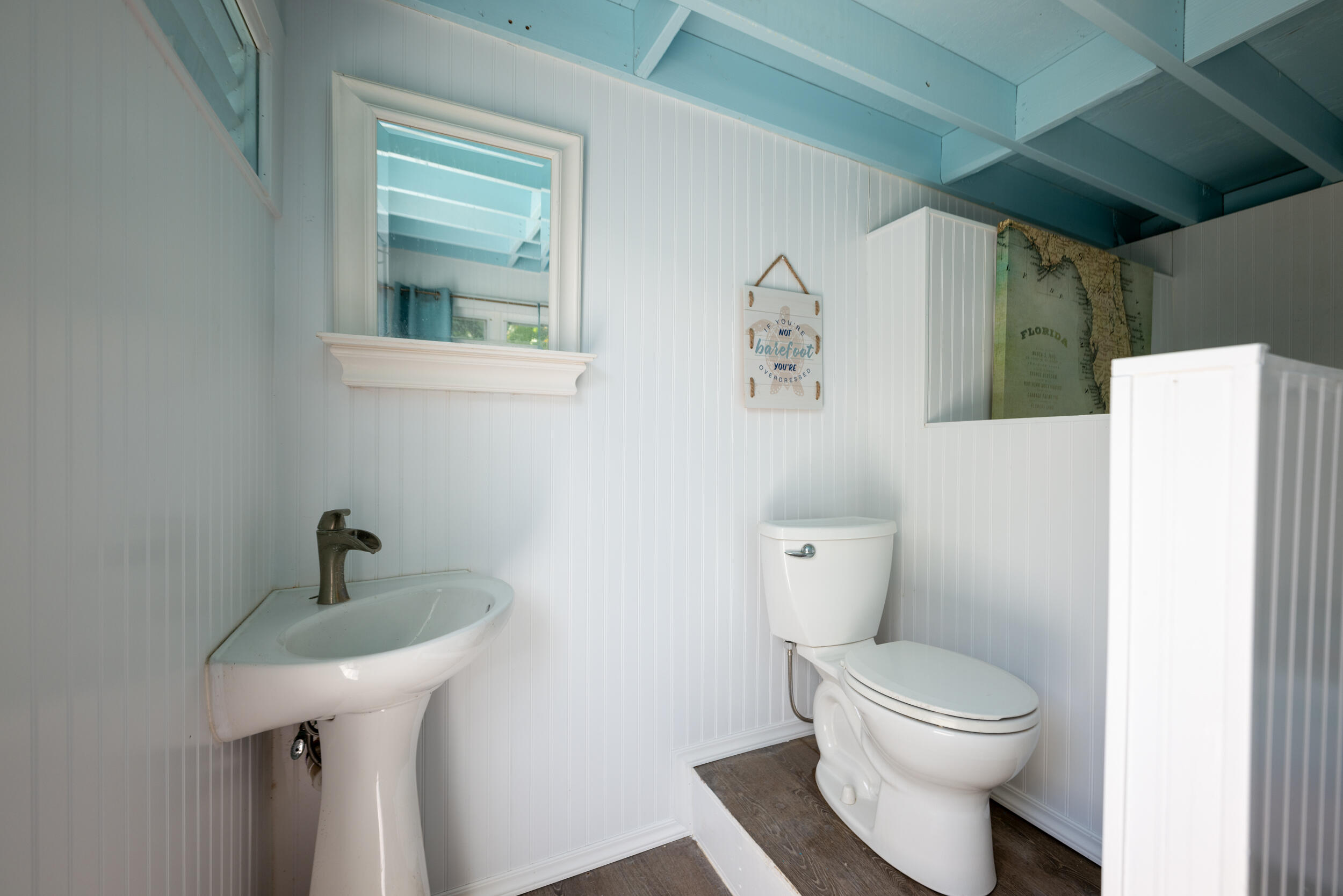 1109 Stump Lane Key West, FL 33040 - Photo 6 of 38 a bathroom with a sink a toilet and a mirror