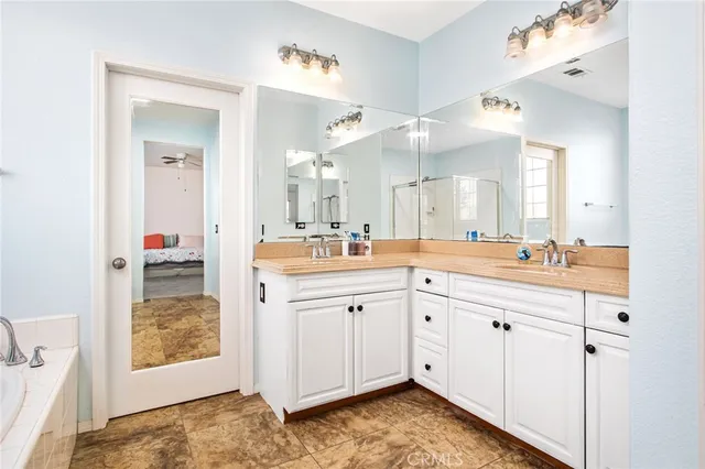 a white bath tub sitting next to a shower