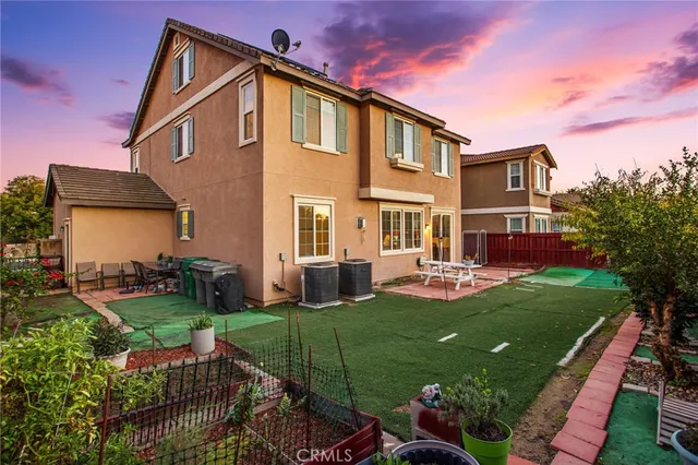 an aerial view of residential house with swimming pool and mountain view