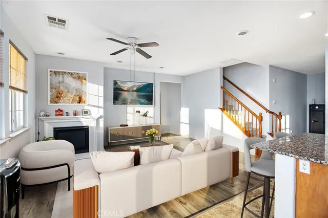 a living room with furniture fireplace and a flat screen tv