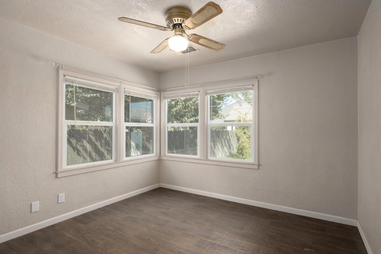 2043 11th Street Reedley, CA 93654 - Photo 12 of 21 an empty room with a window