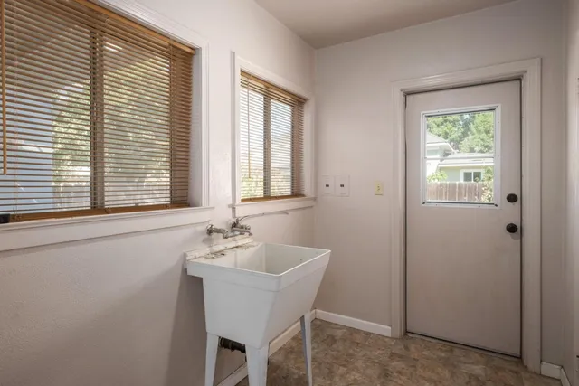 a bathroom with a sink and a window