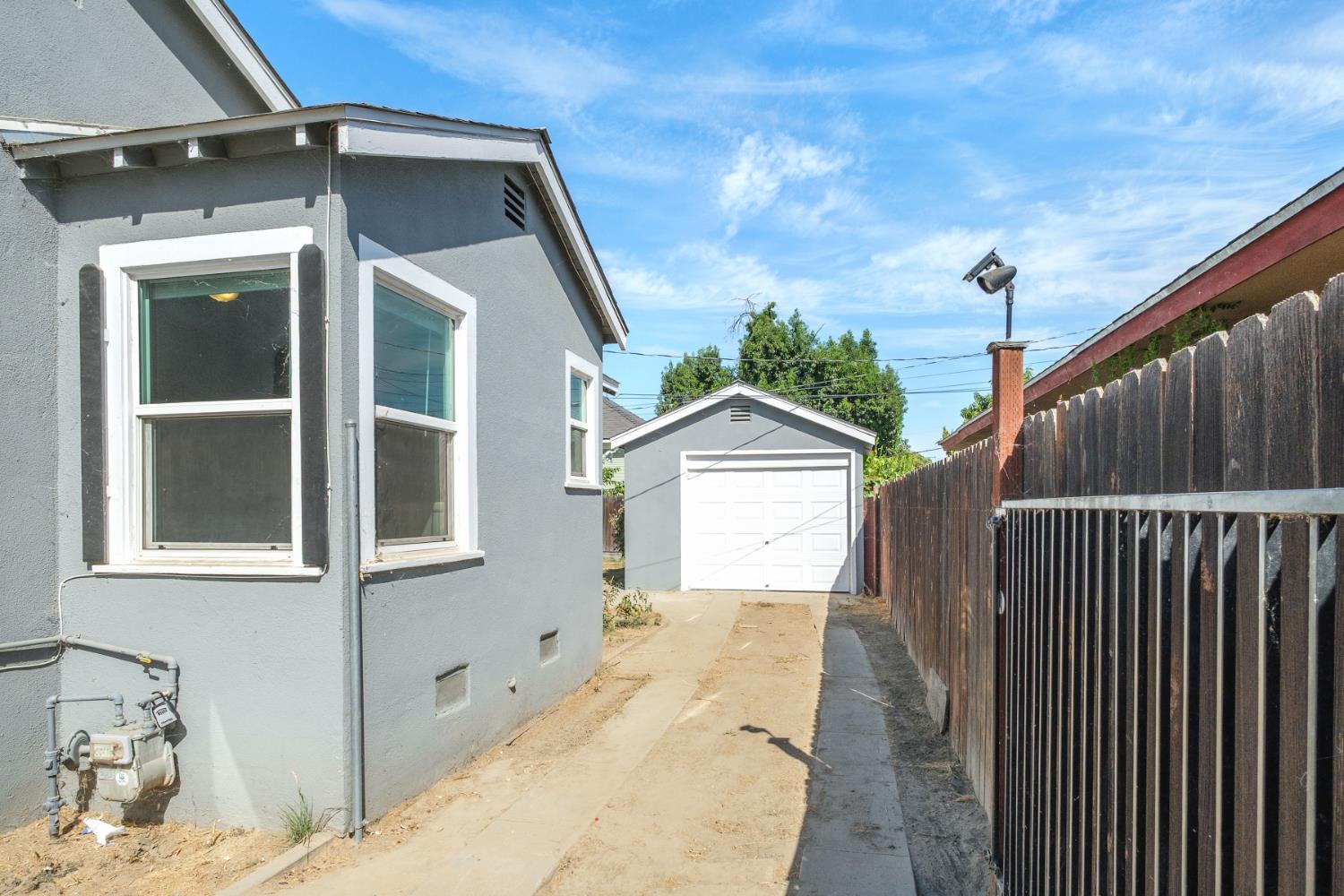 2043 11th Street Reedley, CA 93654 - Photo 16 of 21 a front view of a house with a yard
