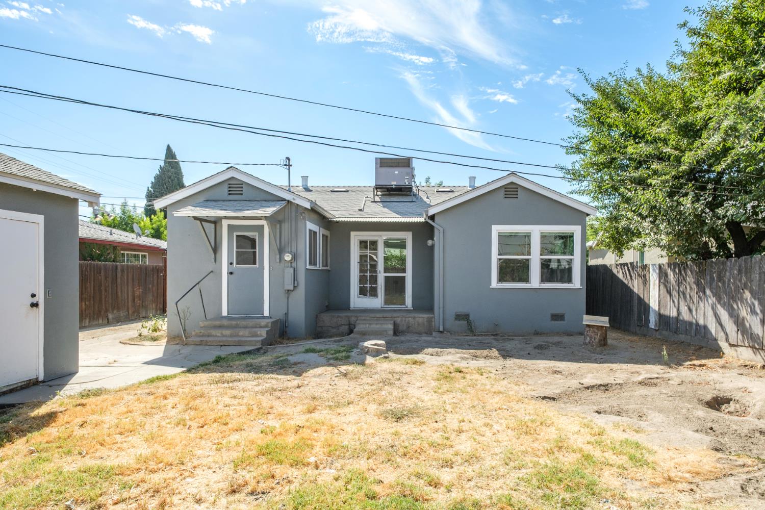 2043 11th Street Reedley, CA 93654 - Photo 17 of 21 a front view of a house with a yard