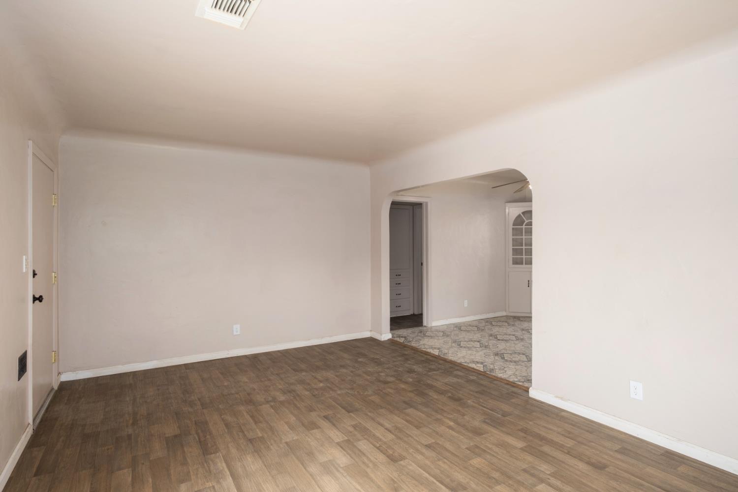 2043 11th Street Reedley, CA 93654 - Photo 3 of 21 a view of an empty room and wooden floor