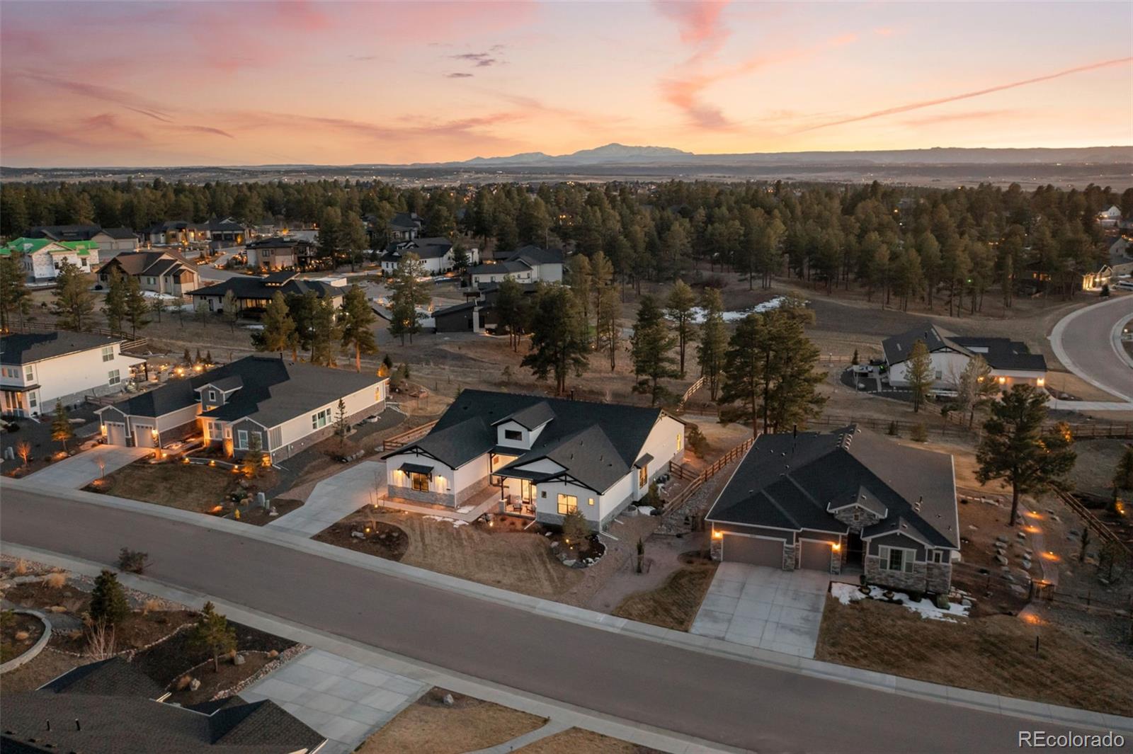 6001 Powell Road Parker, CO 80134 - Photo 2 of 50 a view of a terrace with a bench and mountain view
