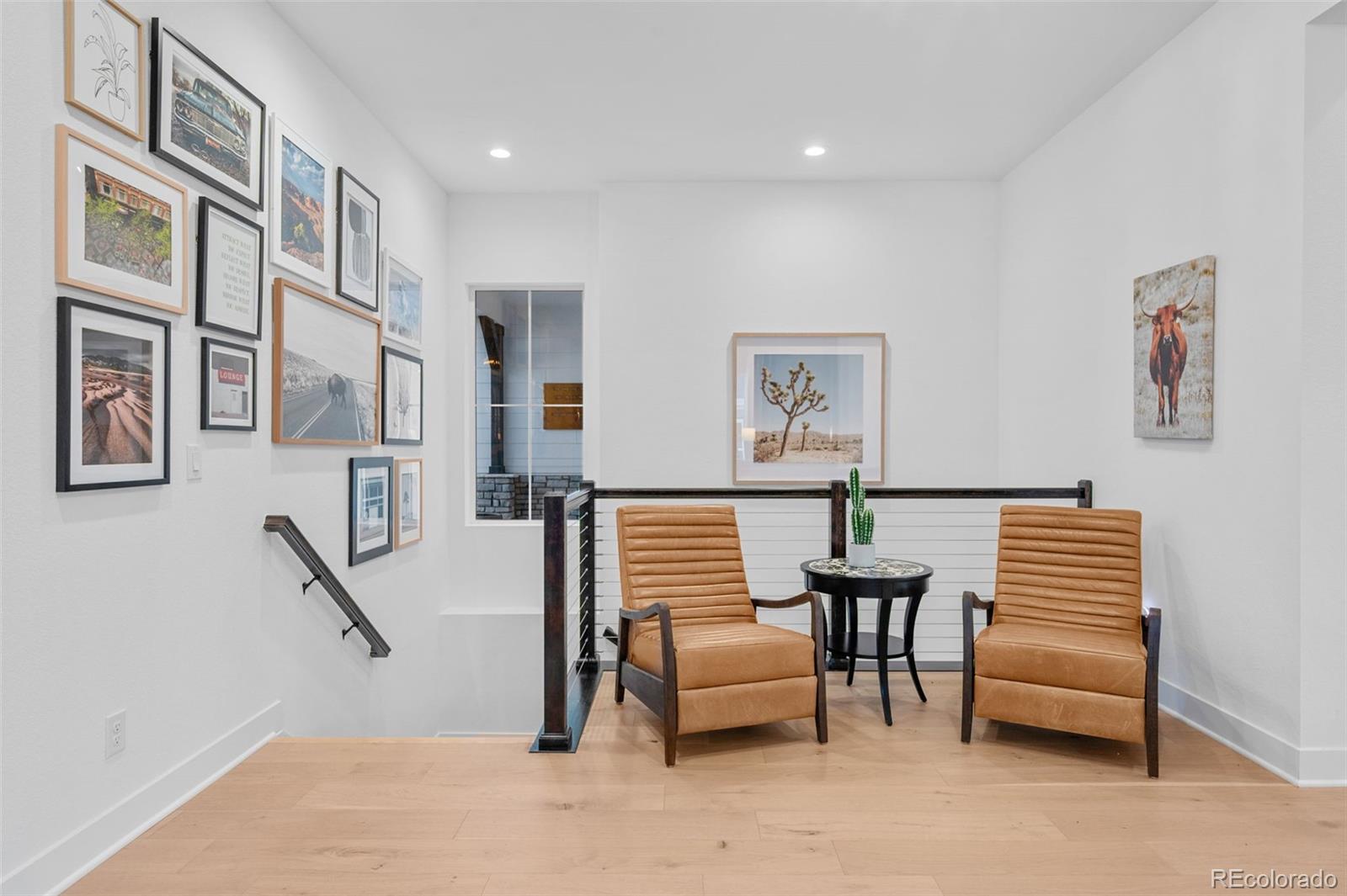 6001 Powell Road Parker, CO 80134 - Photo 22 of 50 a view of hall way with furniture and stairs
