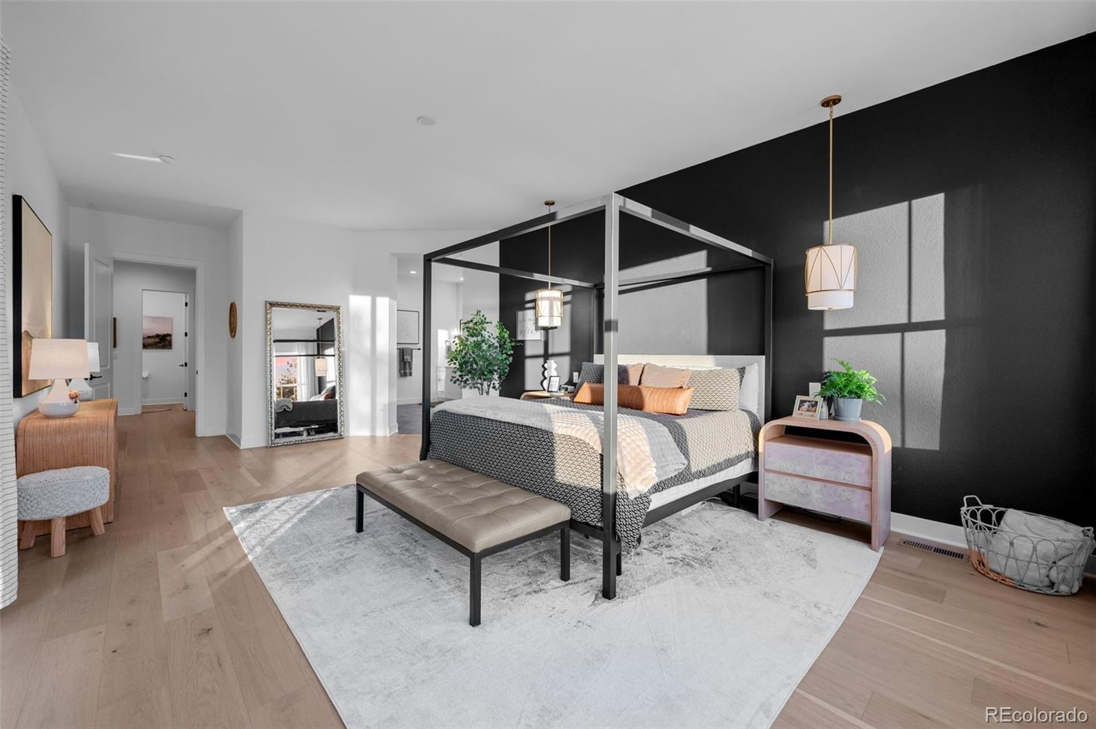 6001 Powell Road Parker, CO 80134 - Photo 27 of 50 a bedroom with furniture and a potted plant