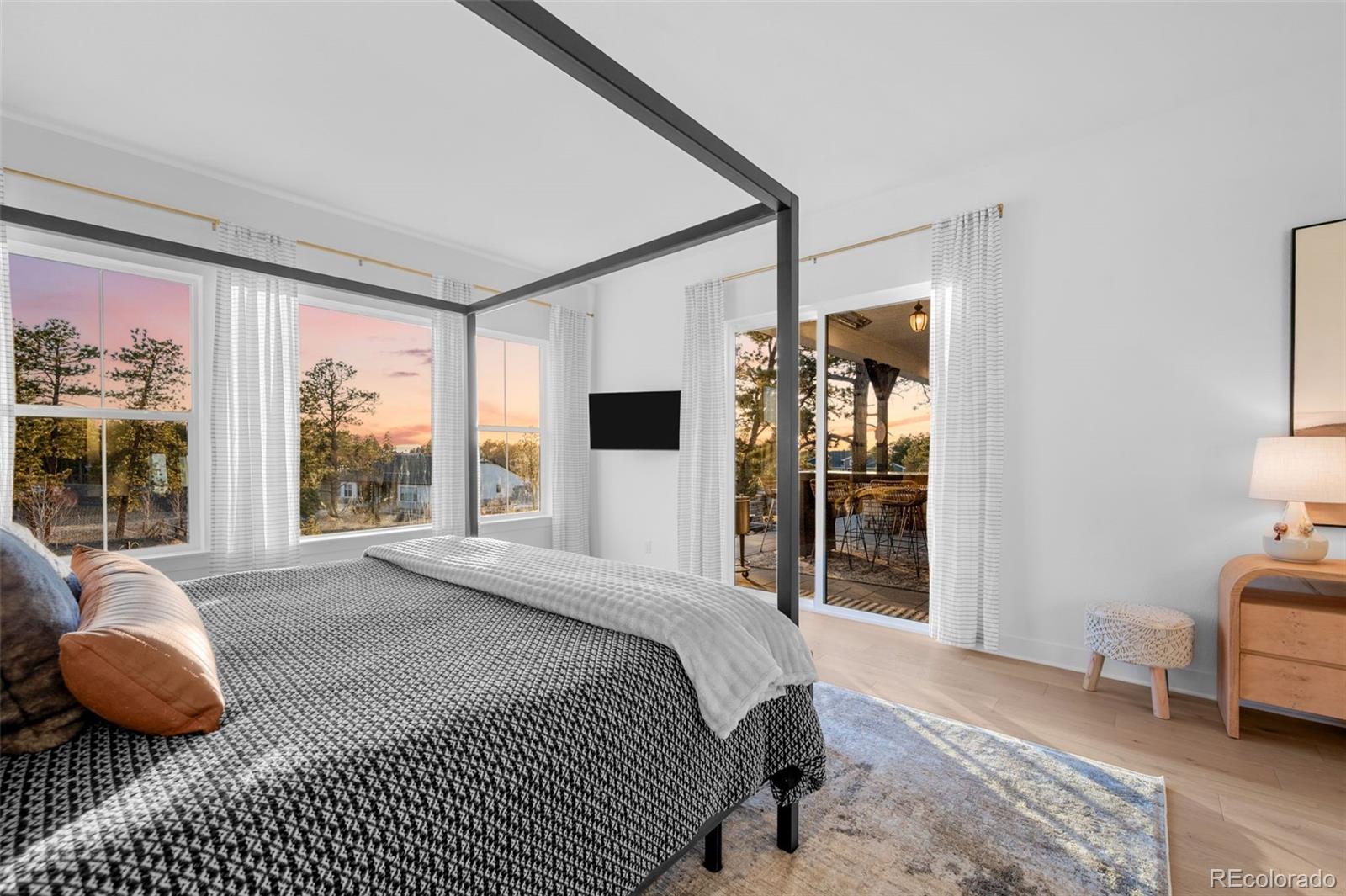 6001 Powell Road Parker, CO 80134 - Photo 28 of 50 a bedroom with a bed mirror and window