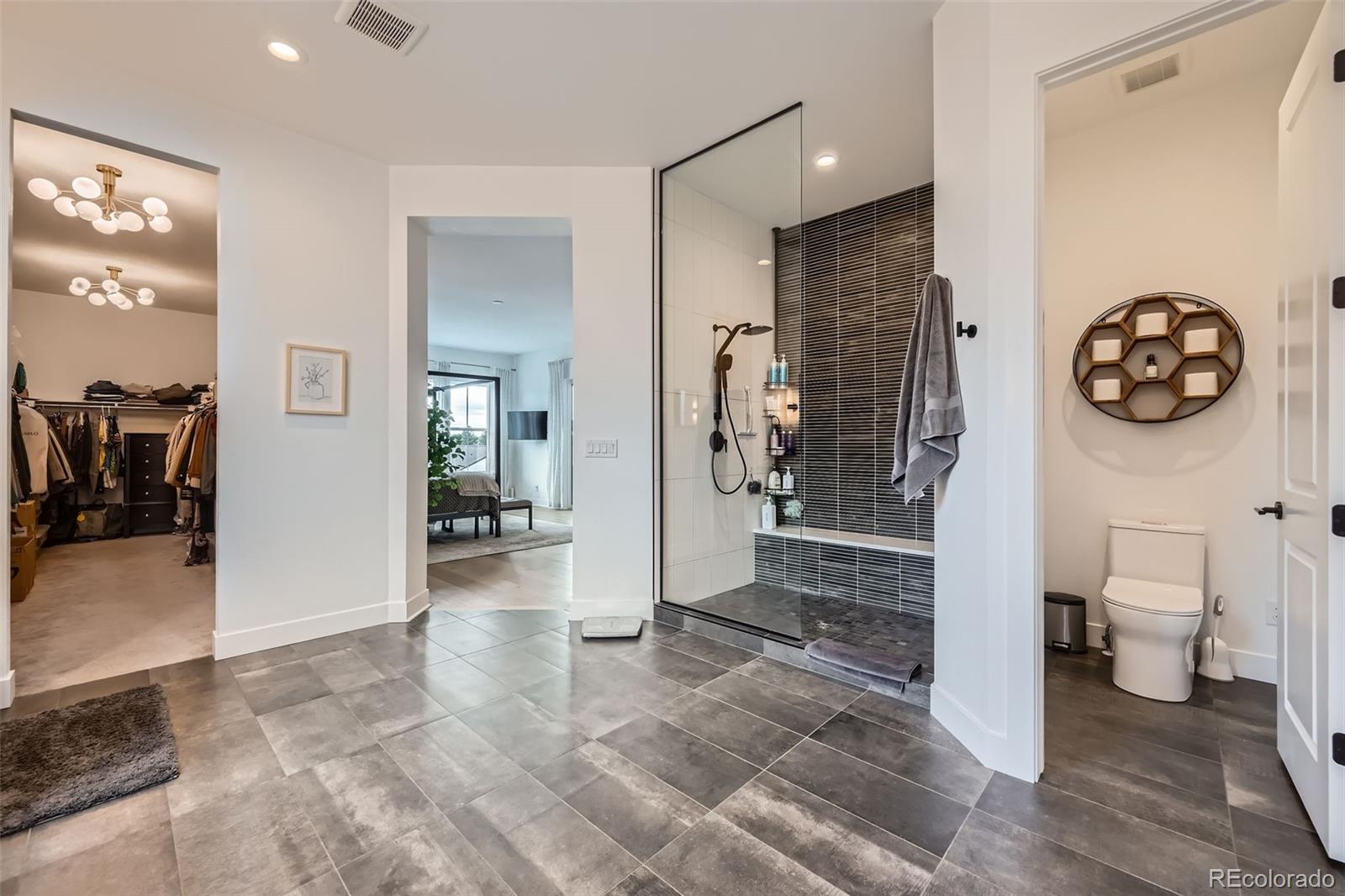 6001 Powell Road Parker, CO 80134 - Photo 31 of 50 a view of livingroom with hardwood floor and a ceiling fan