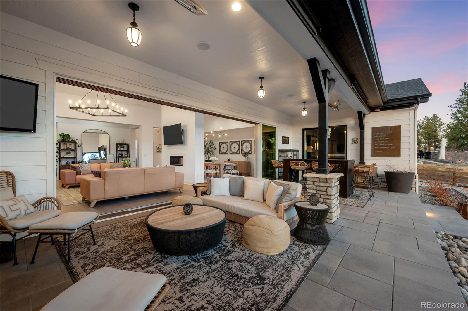 6001 Powell Road Parker, CO 80134 - Photo 38 of 50 a living room with furniture wooden floor and a flat screen tv