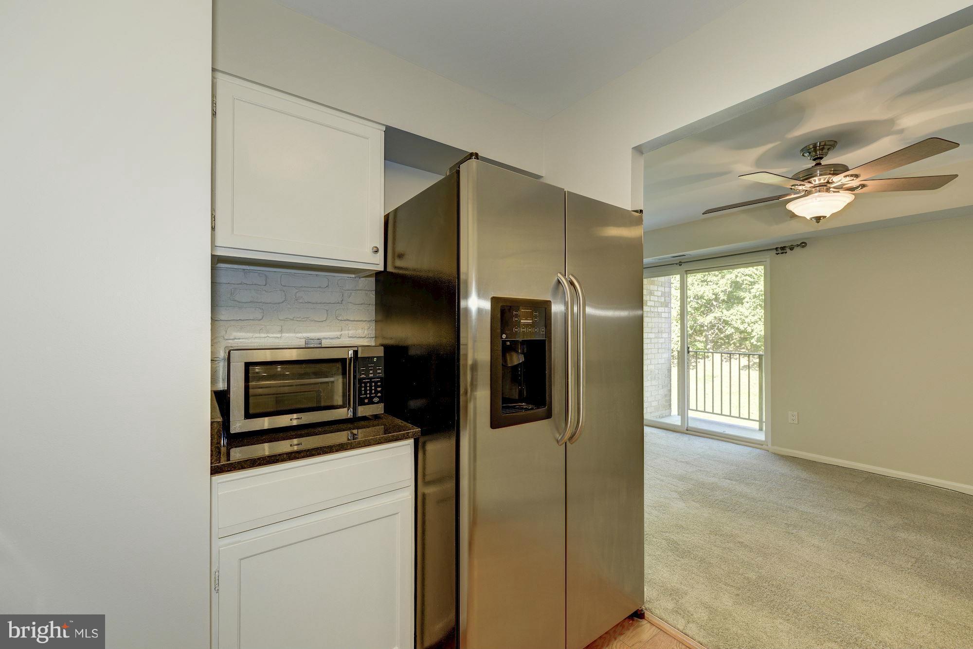 6155 Edsall Road, Unit H Alexandria, VA 22304 - Photo 15 of 30 a kitchen with stainless steel appliances a refrigerator sink and stove