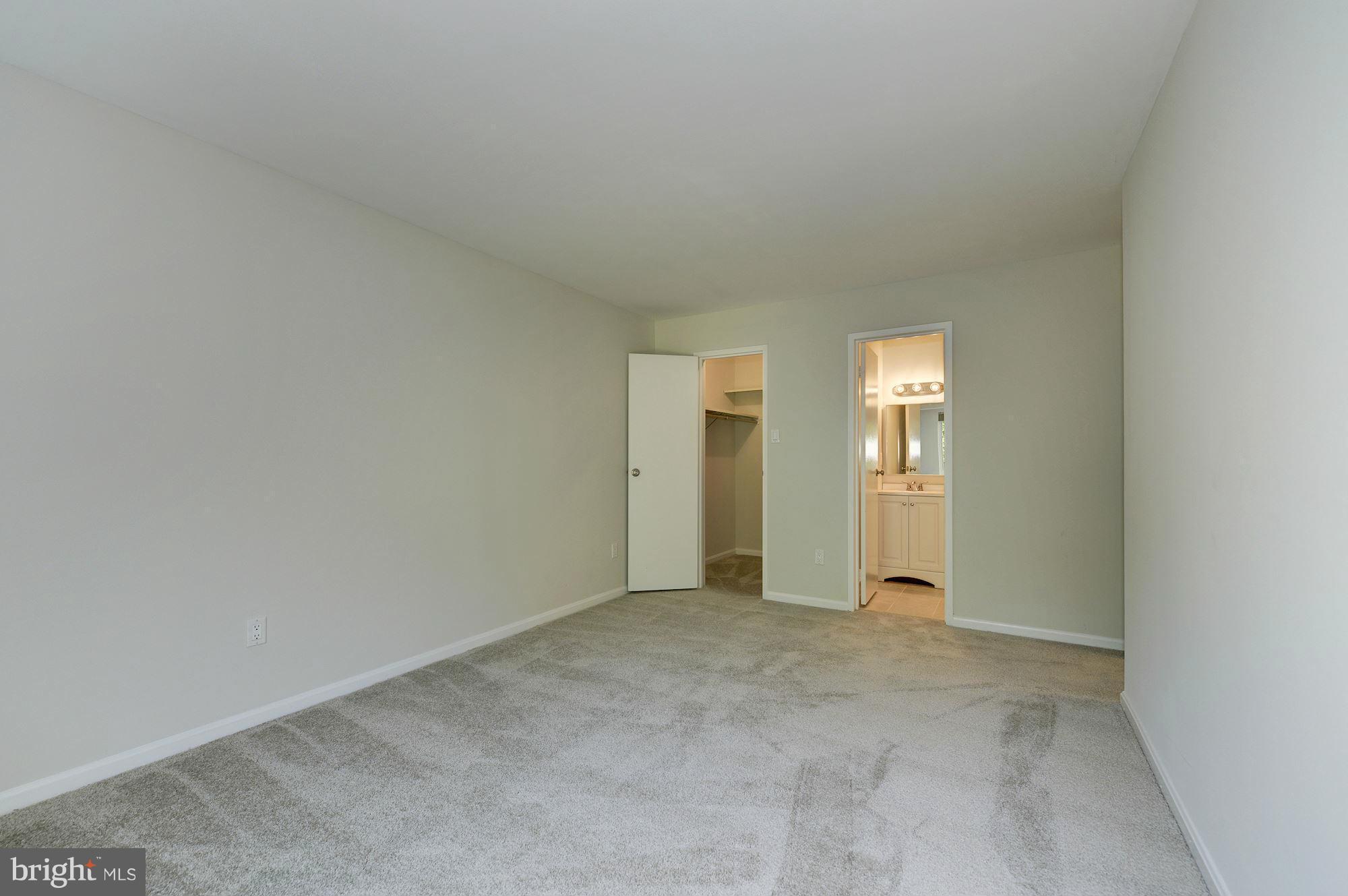 6155 Edsall Road, Unit H Alexandria, VA 22304 - Photo 18 of 30 an empty room with windows