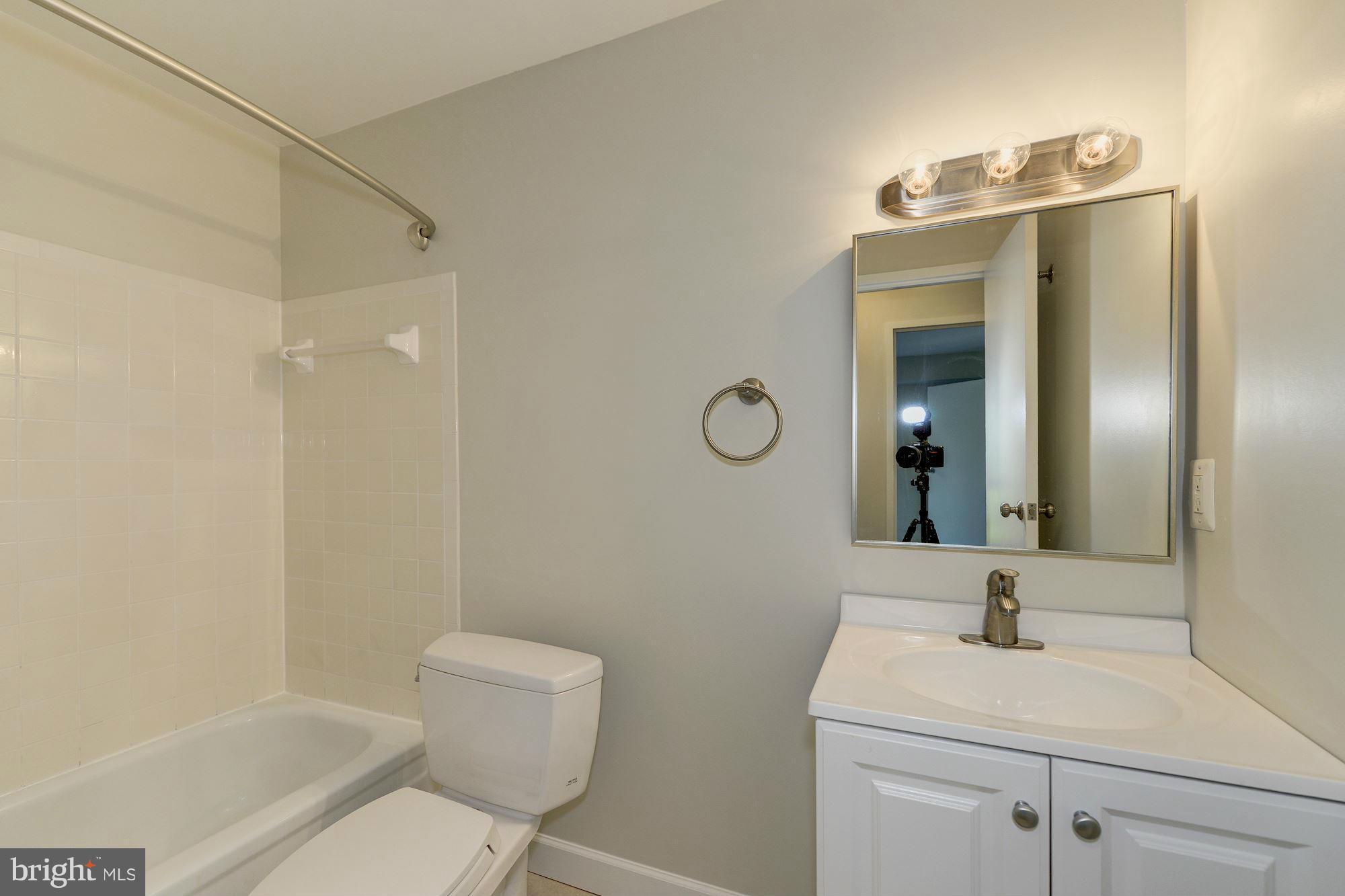 6155 Edsall Road, Unit H Alexandria, VA 22304 - Photo 24 of 30 a bathroom with a sink toilet and shower