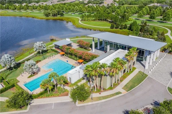 an aerial view of a house with a garden and swimming pool