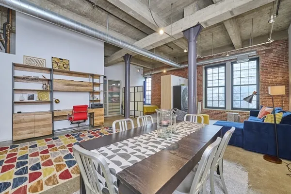a outdoor space with lots of furniture and wooden floor