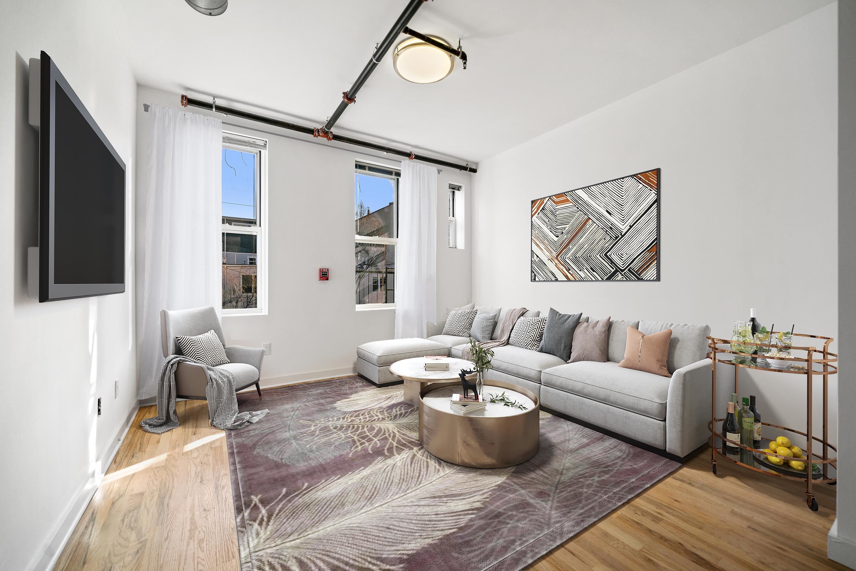 615 Monroe Street, Unit 1 Hoboken, NJ 07030 - Photo 1 of 10 a living room with furniture and a window