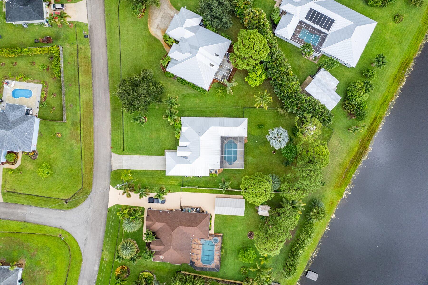 3329 Southwest Crestview Road Port St. Lucie, FL 34953 - Photo 2 of 50 44-DJI_0240-Edit