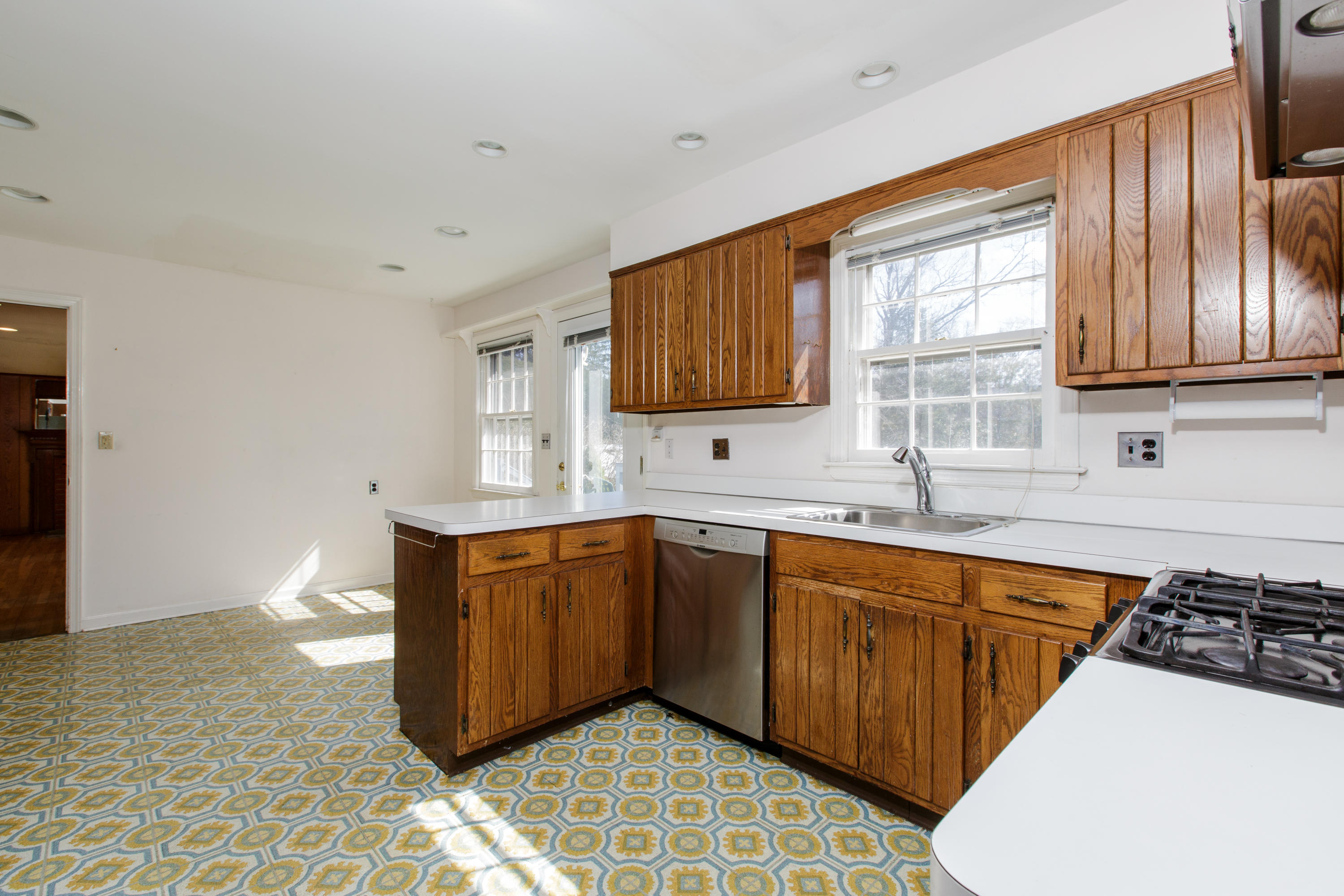19 Interlaken Road Stamford, CT 06903 - Photo 11 of 21 a kitchen with stainless steel appliances a sink stove and cabinets