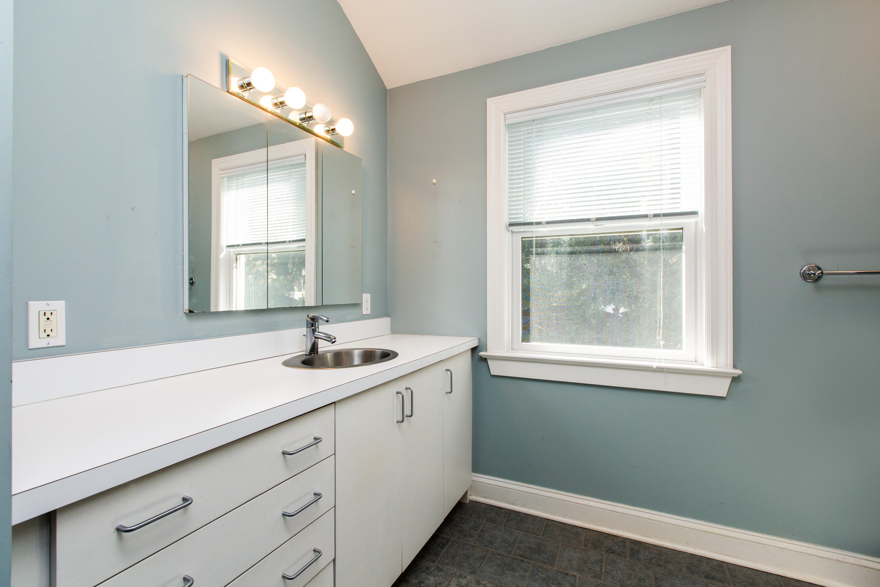 19 Interlaken Road Stamford, CT 06903 - Photo 6 of 21 a bathroom with a sink a vanity and a window