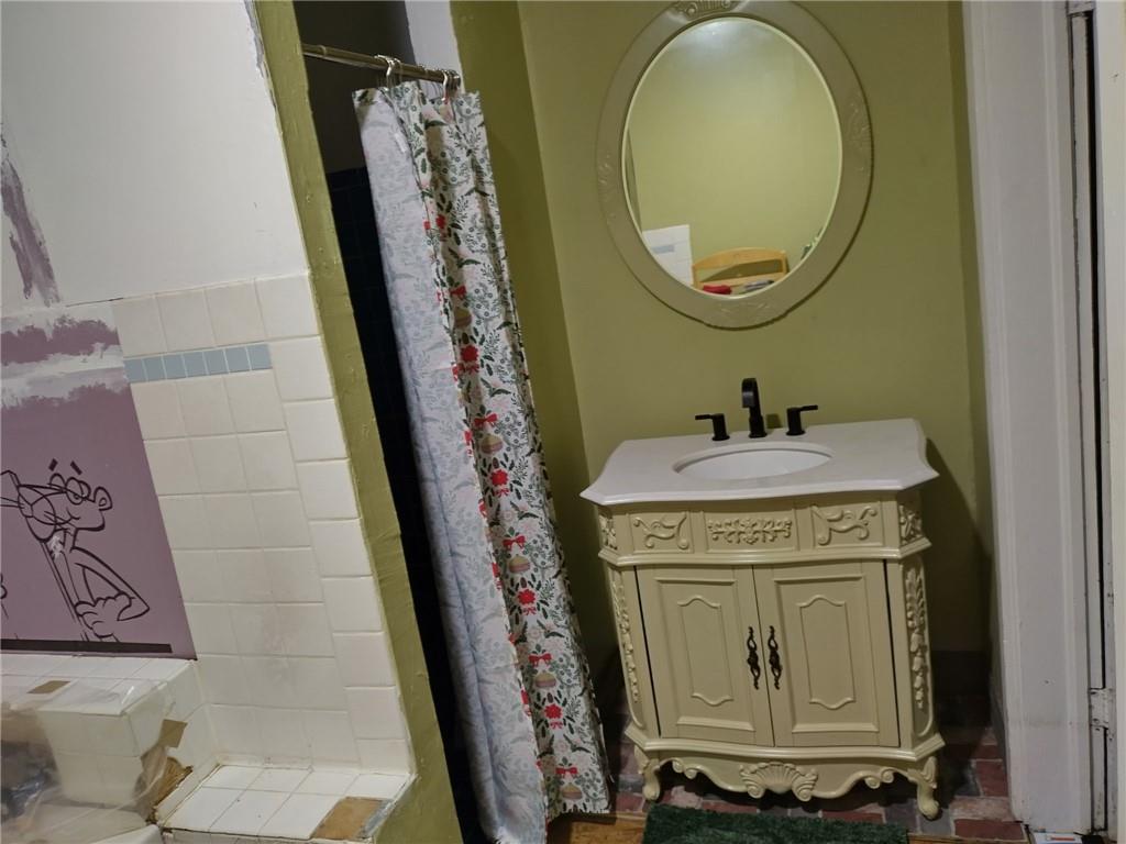 209 Gordon Avenue Calhoun, GA 30701 - Photo 11 of 30 a bathroom with a sink and a mirror