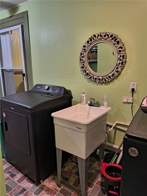 209 Gordon Avenue Calhoun, GA 30701 - Photo 14 of 30 a bathroom with a sink a mirror and a toilet