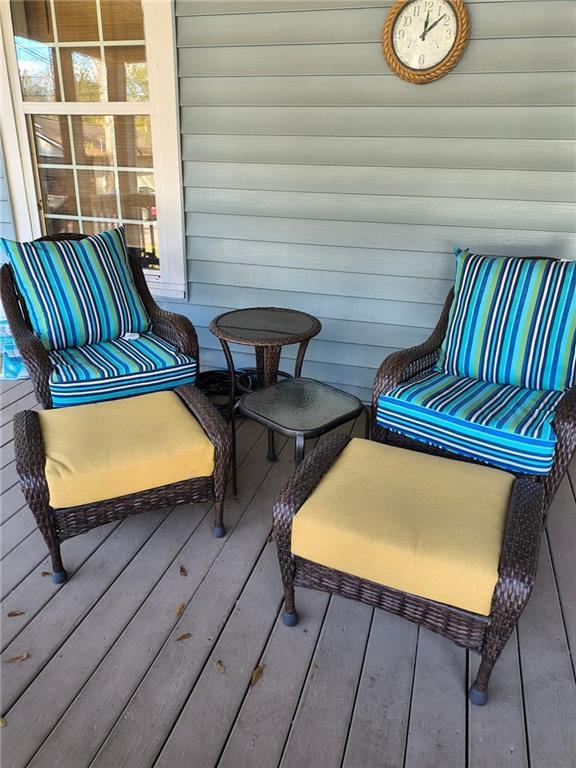 209 Gordon Avenue Calhoun, GA 30701 - Photo 2 of 30 a view of a chairs in a patio