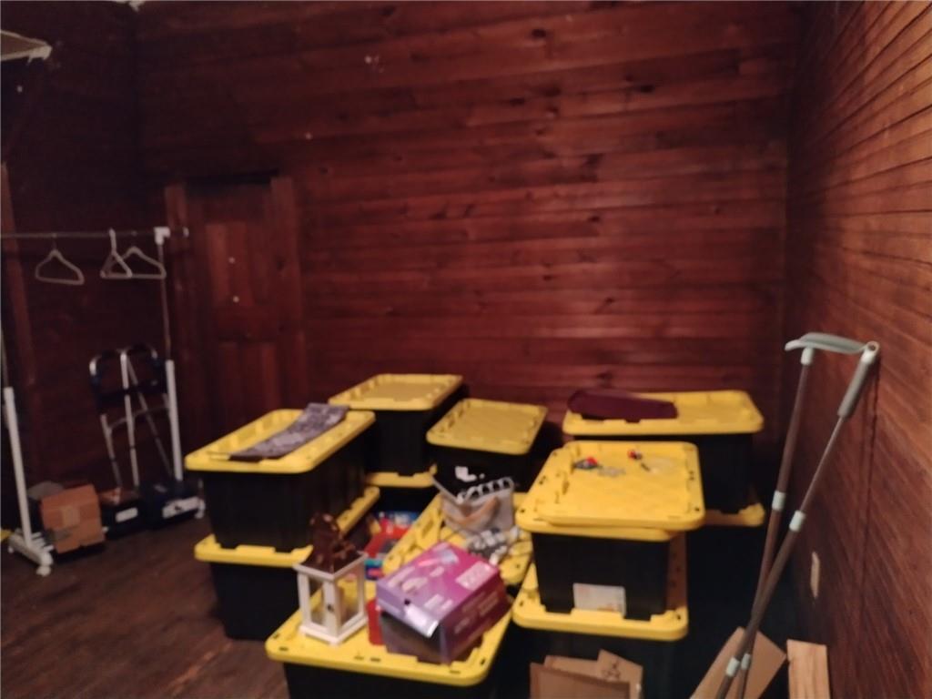 209 Gordon Avenue Calhoun, GA 30701 - Photo 24 of 30 a view of a balcony with chair and wooden floor