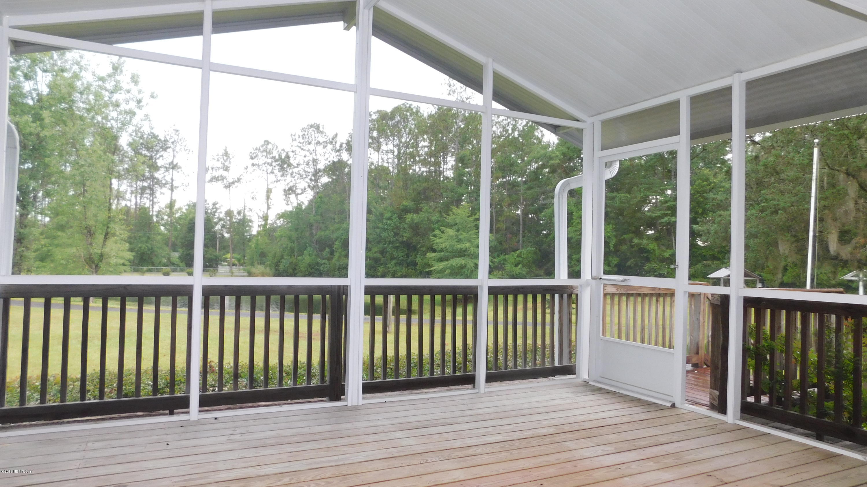 4144 Bronco Road Middleburg, FL 32068 - Photo 23 of 66 a view of a wooden deck