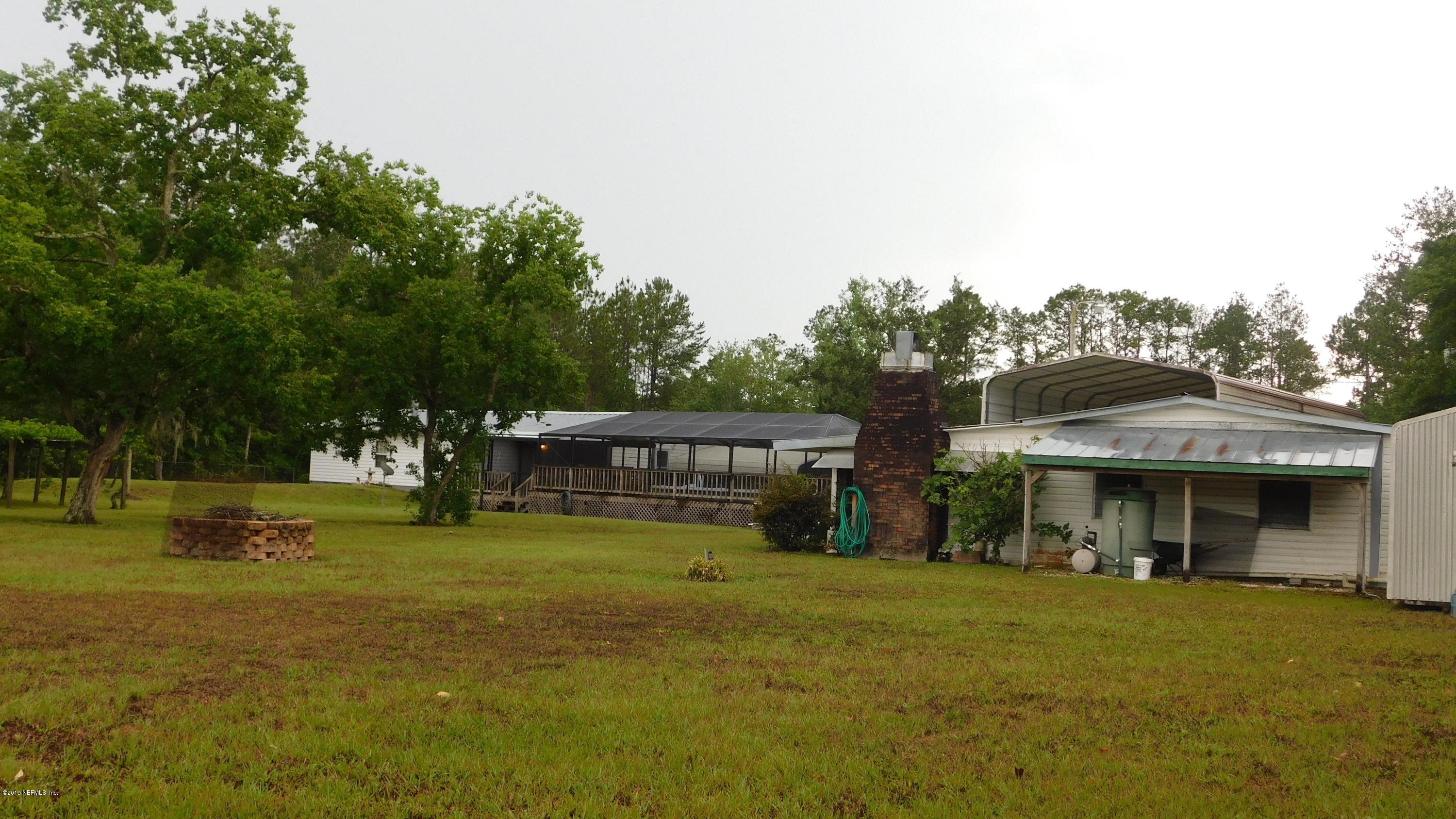 4144 Bronco Road Middleburg, FL 32068 - Photo 49 of 66 a front view of a house with a yard