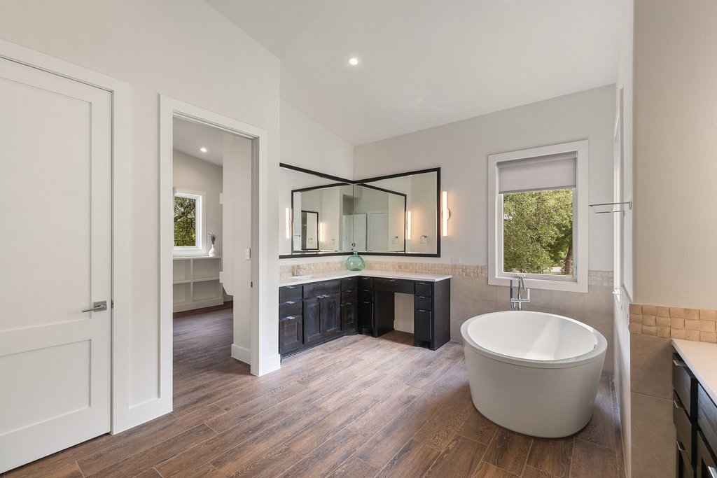 11002 Foundation Road Austin, TX 78726 - Photo 29 of 40 a bathroom with a toilet sink and mirror