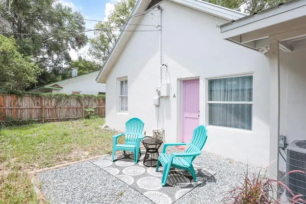 a front view of a house with garden and patio