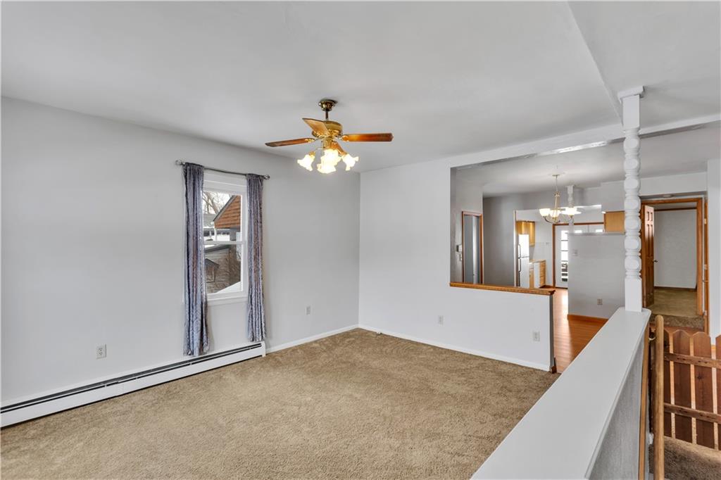 621 Bridge Irwin Pa Irwin, PA 15642 - Photo 2 of 31 wooden floor in an empty room with a mirror