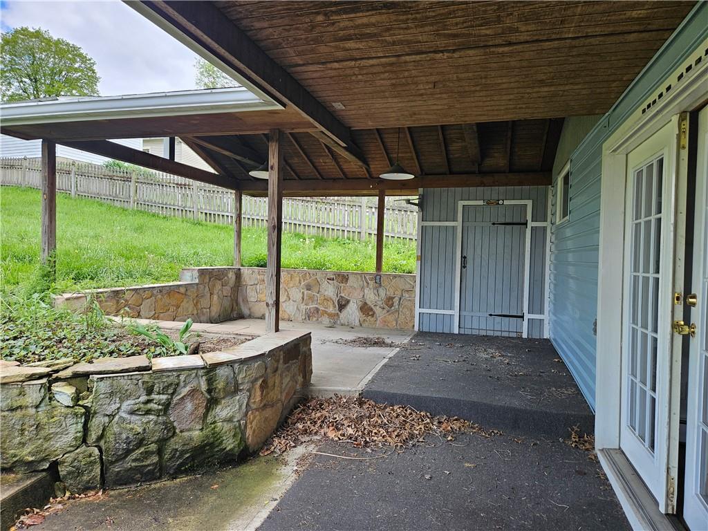 621 Bridge Irwin Pa Irwin, PA 15642 - Photo 26 of 31 a view of a patio with a table and chairs