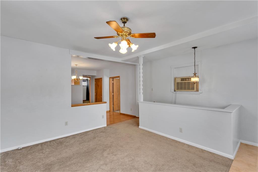 621 Bridge Irwin Pa Irwin, PA 15642 - Photo 3 of 31 a living room with furniture and a chandelier