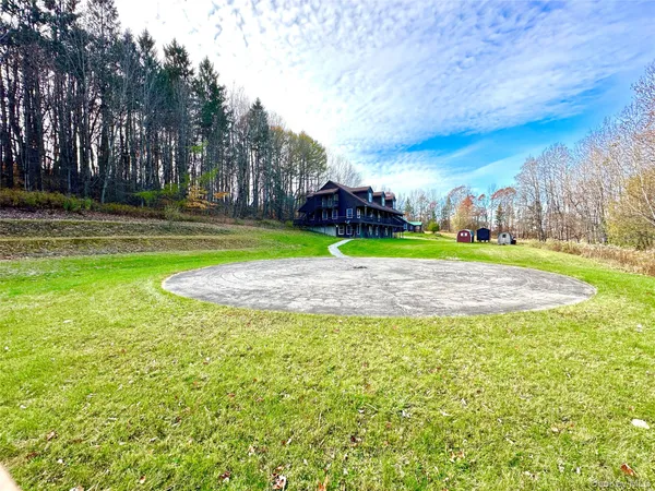 a view of a playground with basketball court