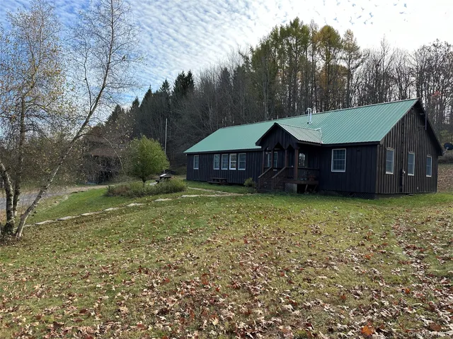 a house view with a garden space