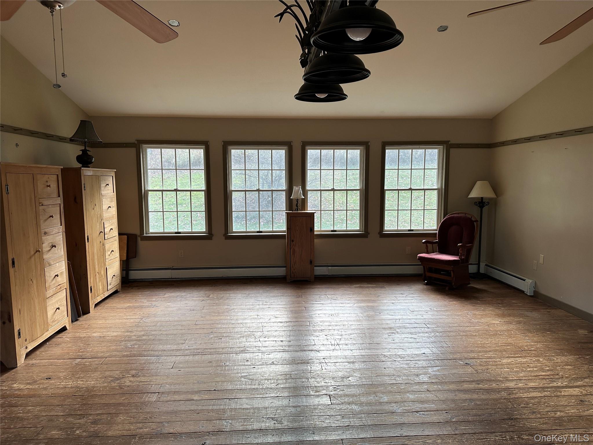 742 New Turnpike Road Sherburne, NY 13460 - Photo 10 of 15 a living room with furniture and a fireplace