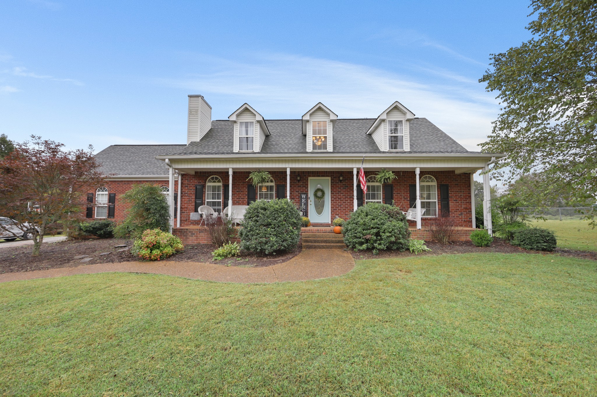 front view of a house with a yard